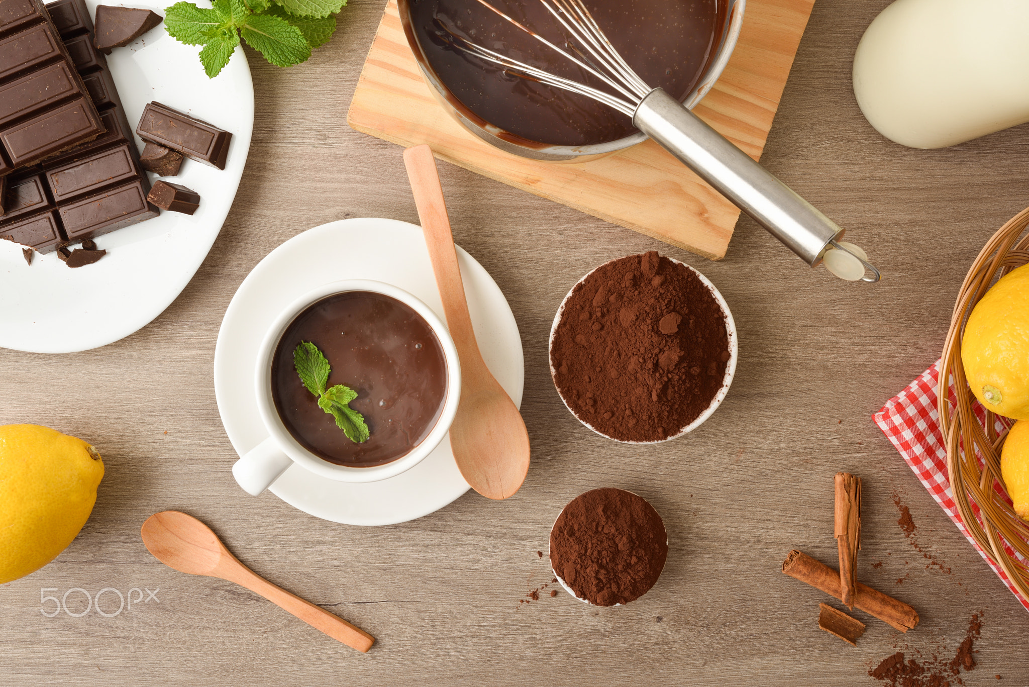 Cup homemade hot chocolate freshly served from the saucepan top