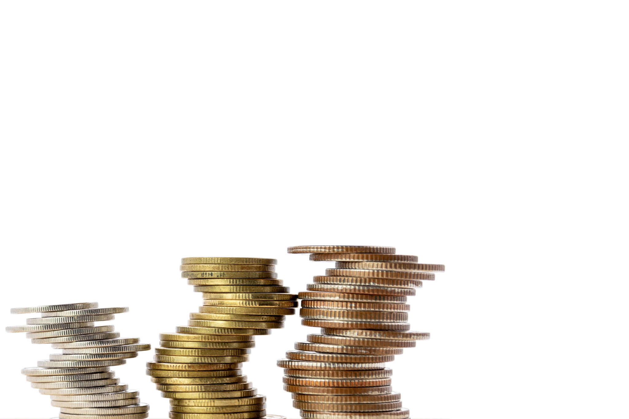 Stack of coins isolated on white background, with copy space.