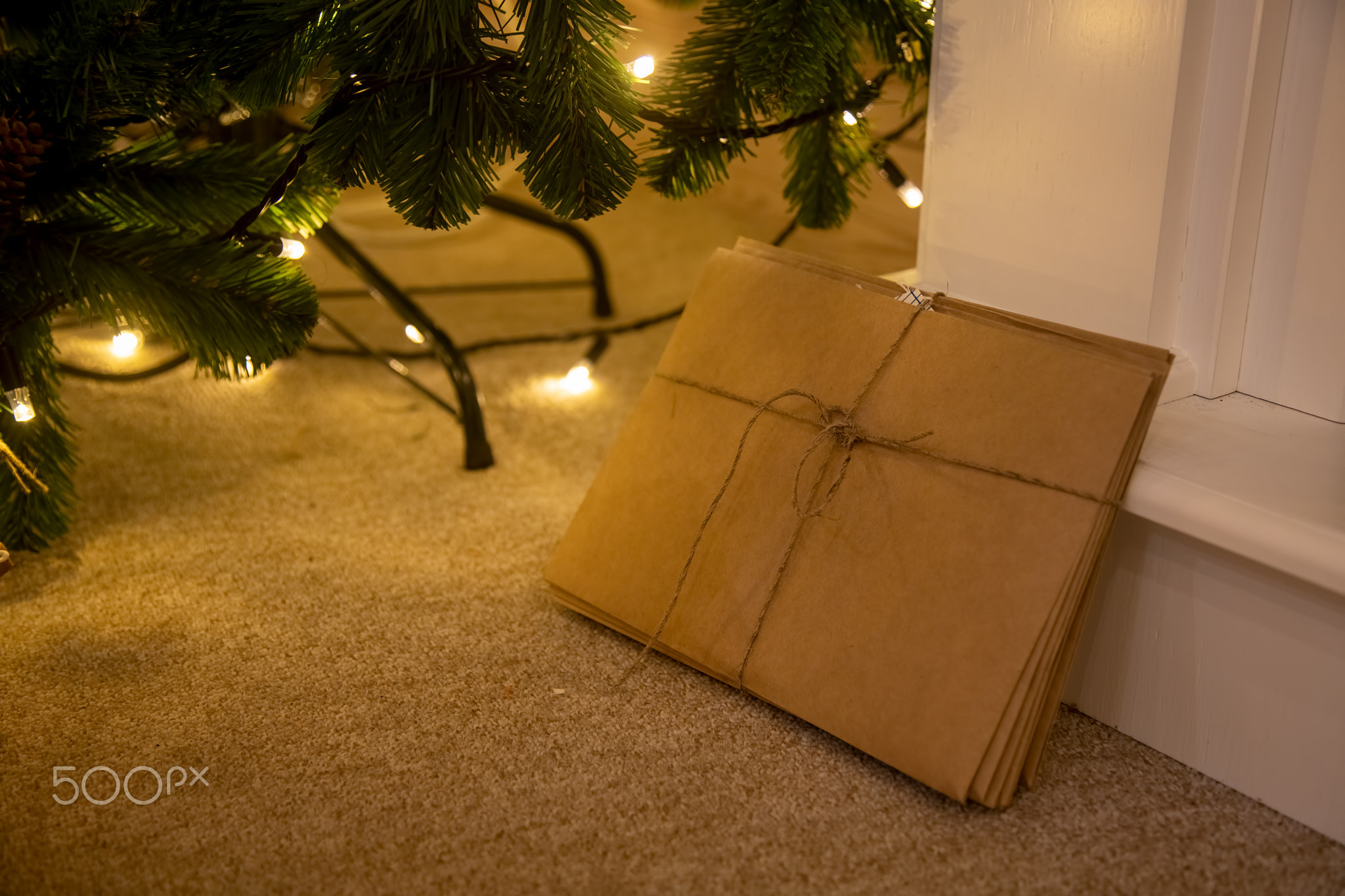 bunch of letters to Santa Claus made of craft paper tied with a rope