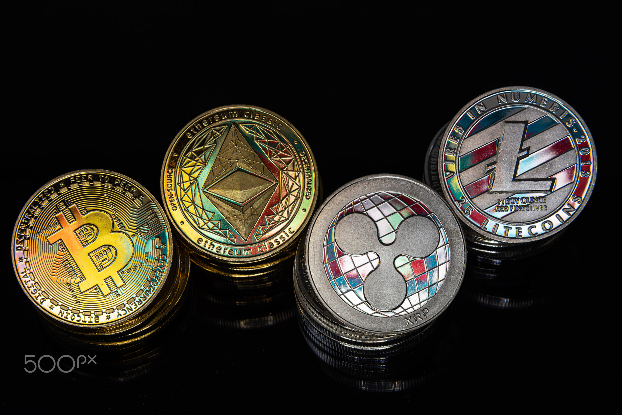 Horizontal view of cryptocurrency tokens, including Bitcoin, Ethererum