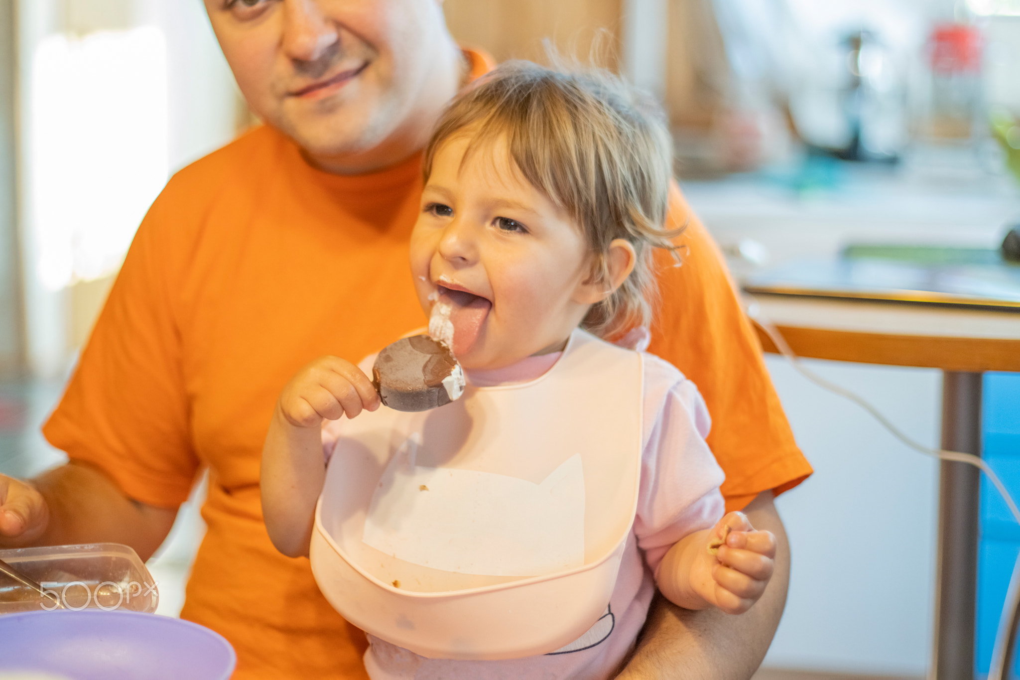 baby try ice cream first time. toddler lick ice cream with happy