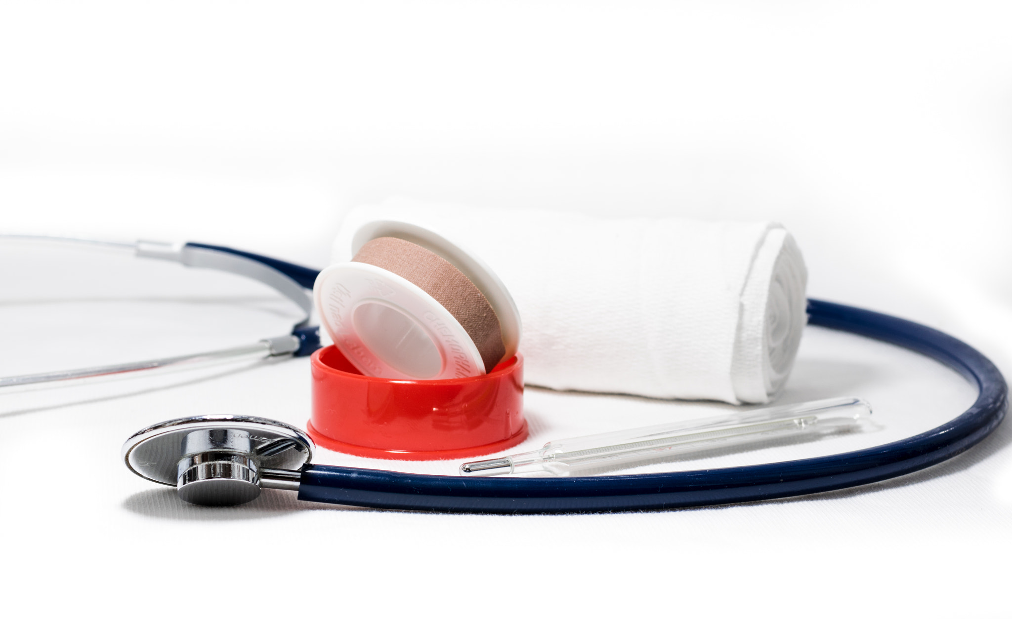 Medical tools concept - stethoscope, bandage, plaster and a thermometer