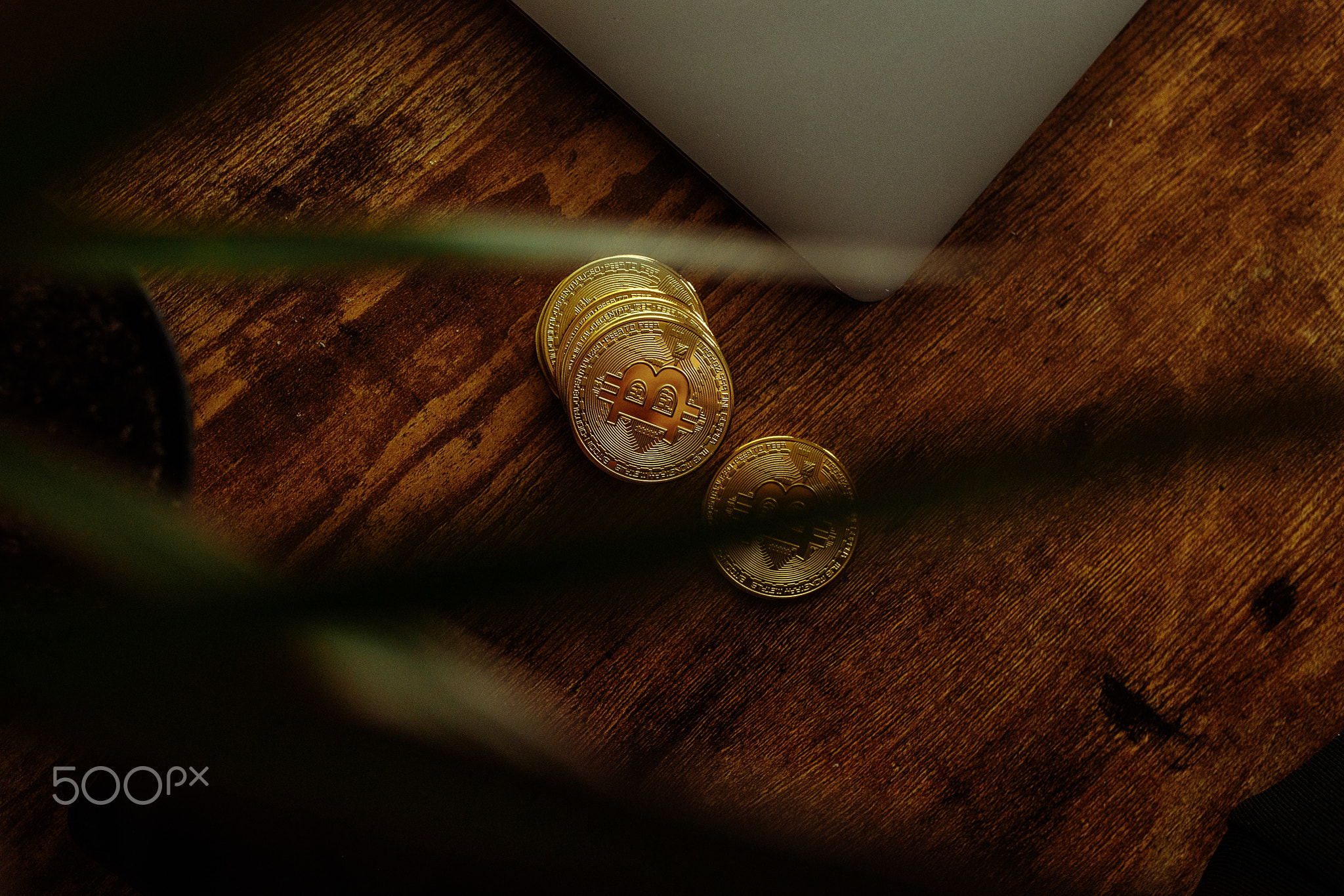 Bitcoins on a wooden background.