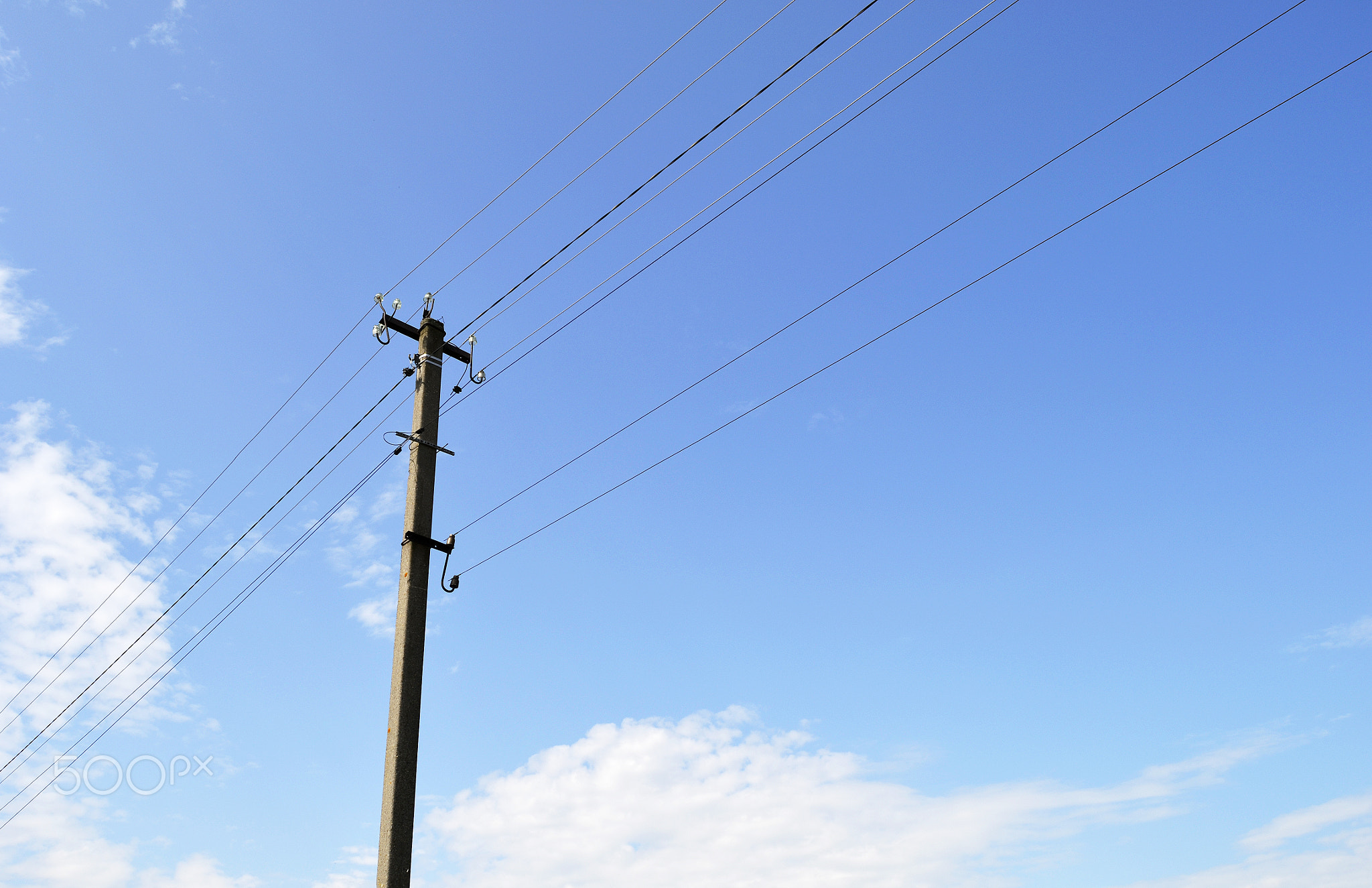 Power electric pole with line wire on colored background close up