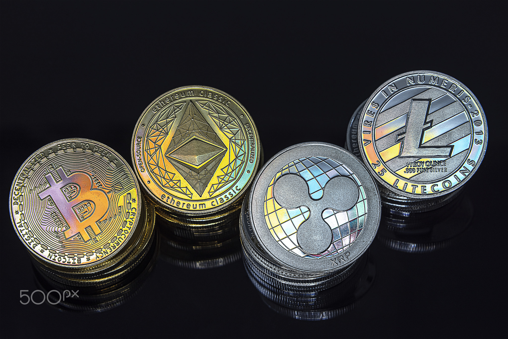 Horizontal view of cryptocurrency tokens, including Bitcoin, Ethererum