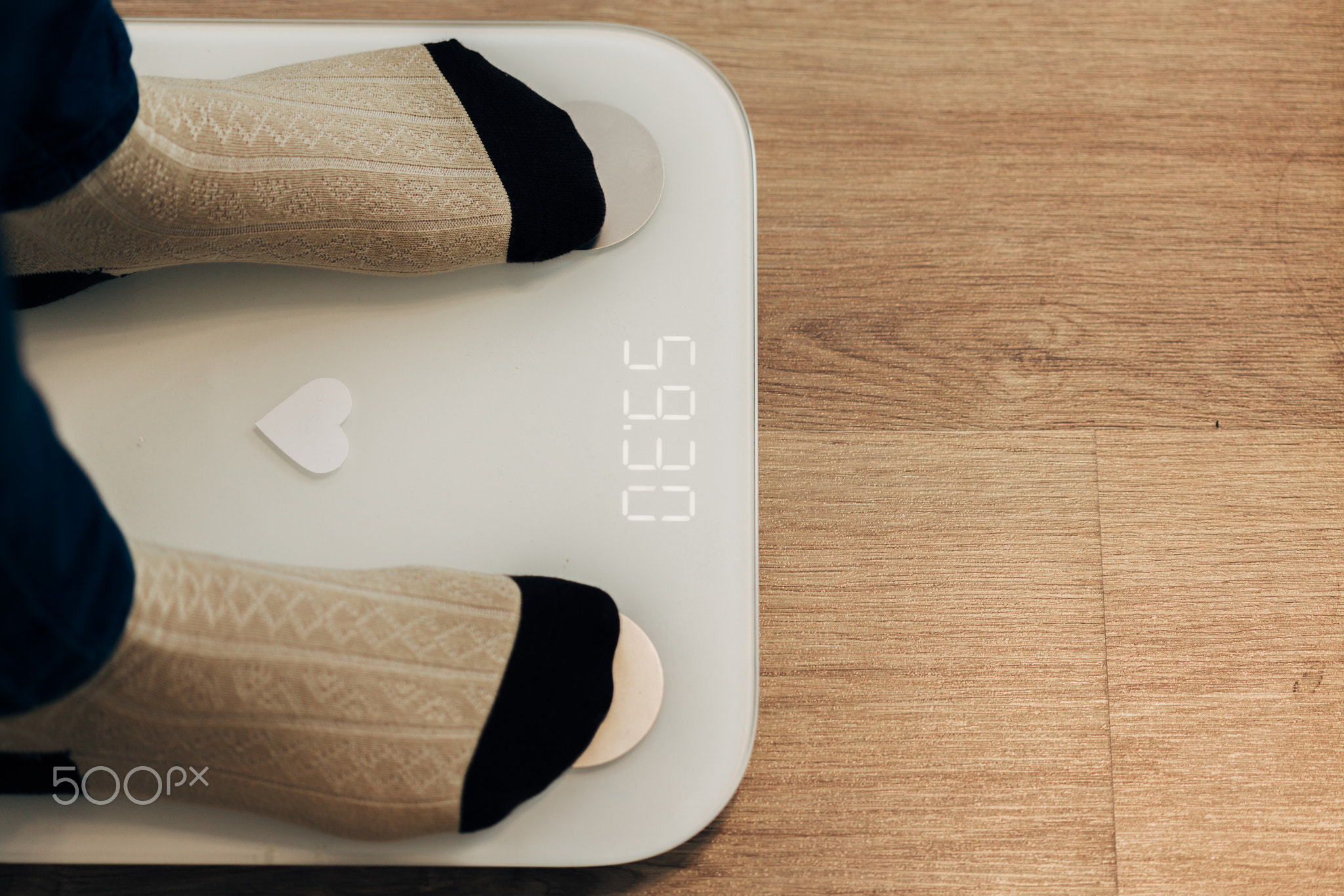 Girl Measures Weight on Smart Scales. Modern Electronic Device.