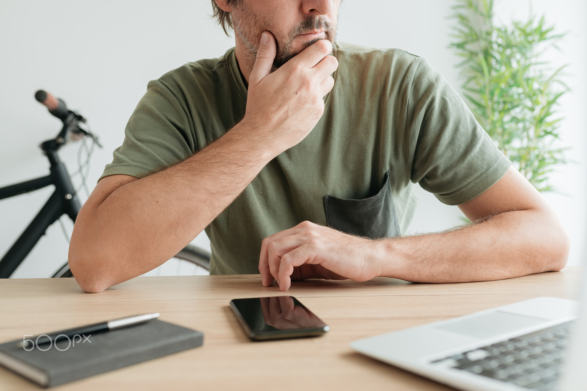 Telecommuter sitting at home office desk