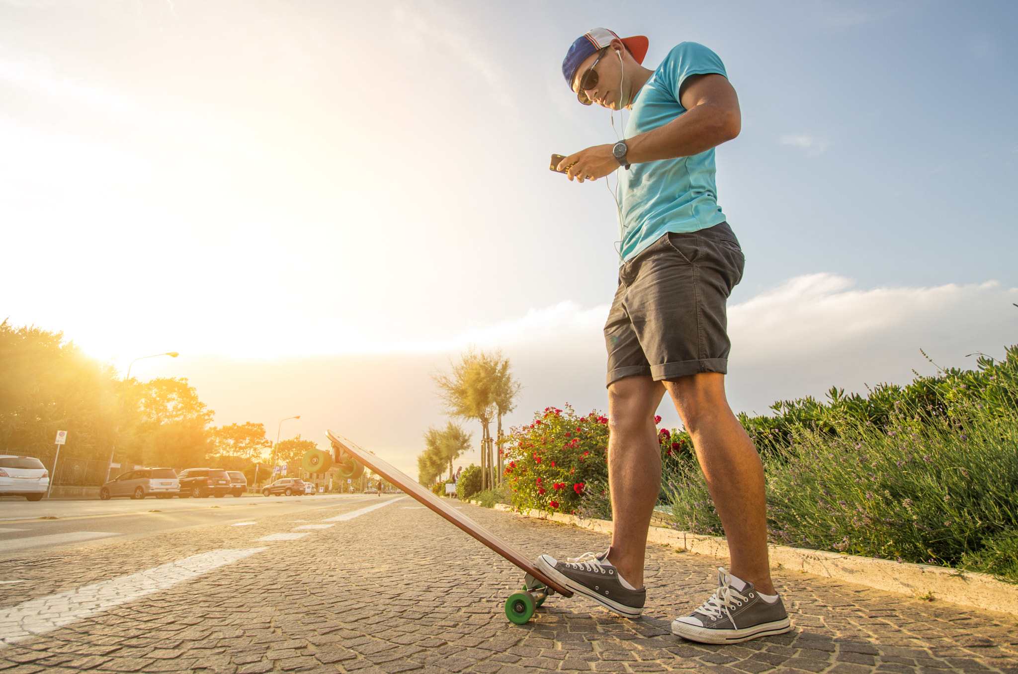 Man on longboard at sunset by fabio formaggio / 500px