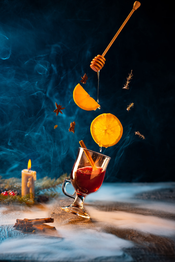 Greeting card design. Cup of hot mulled wine with cinnamon stick and by Volodymyr Melnyk on 500px.com