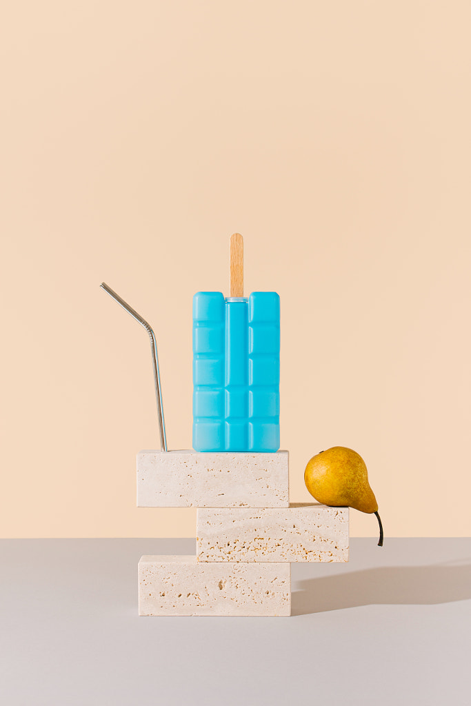 Metal straw, cooler pack popsicle and pear on marble blocks by Ilija Perkovic on 500px.com