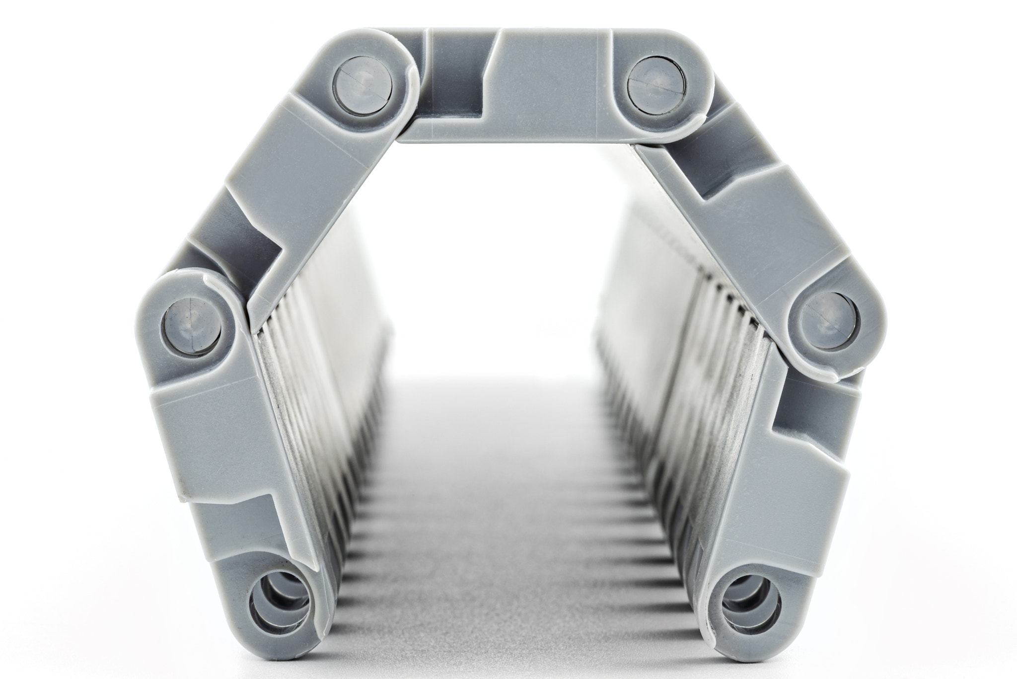 Background made of macro photos of a tunnel-shaped plastic conveyor.