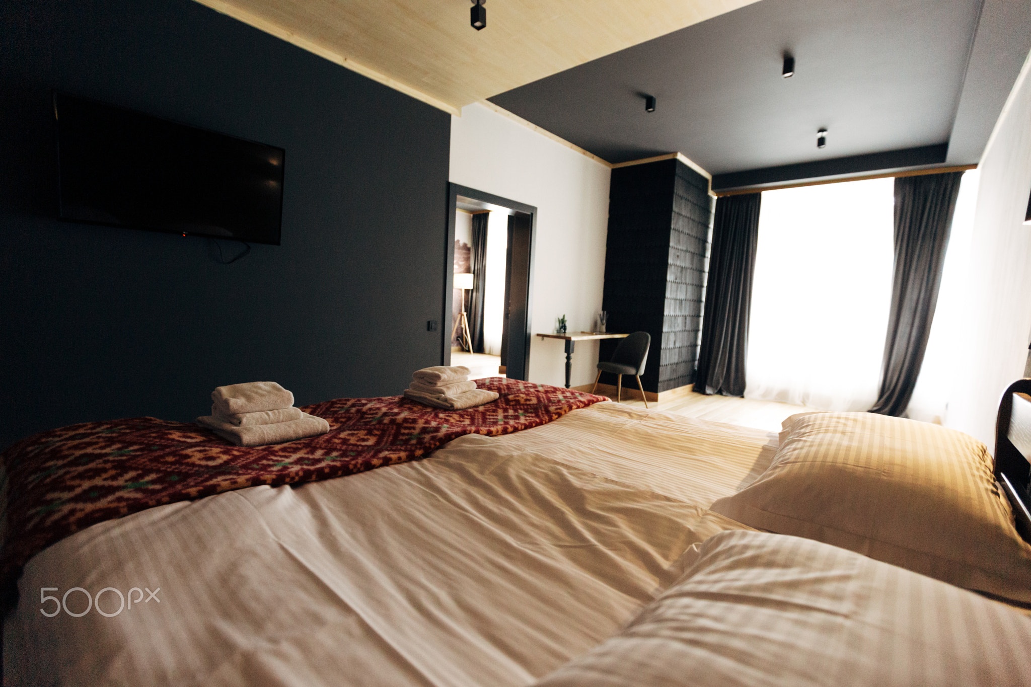Hotel room. Wood finish. Beautiful interior with big window