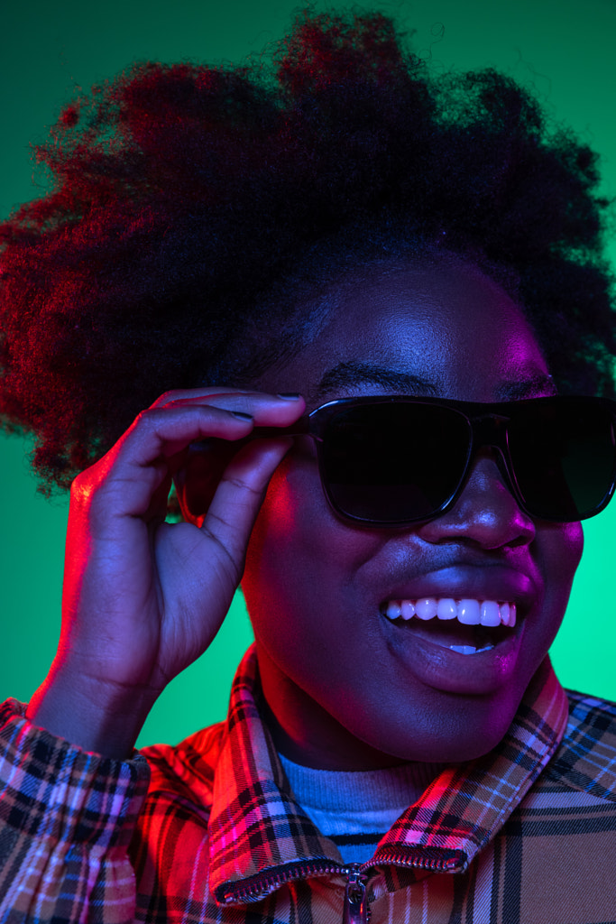 Close-up face of dark skinned young girl in sunglasses isolated on by Volodymyr Melnyk on 500px.com