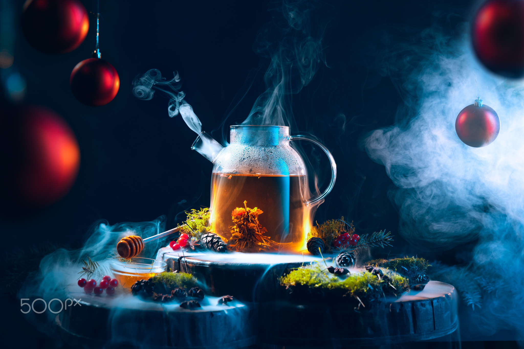 Magic of new year's eve. Tea pot with hot tea on Christmas decorated