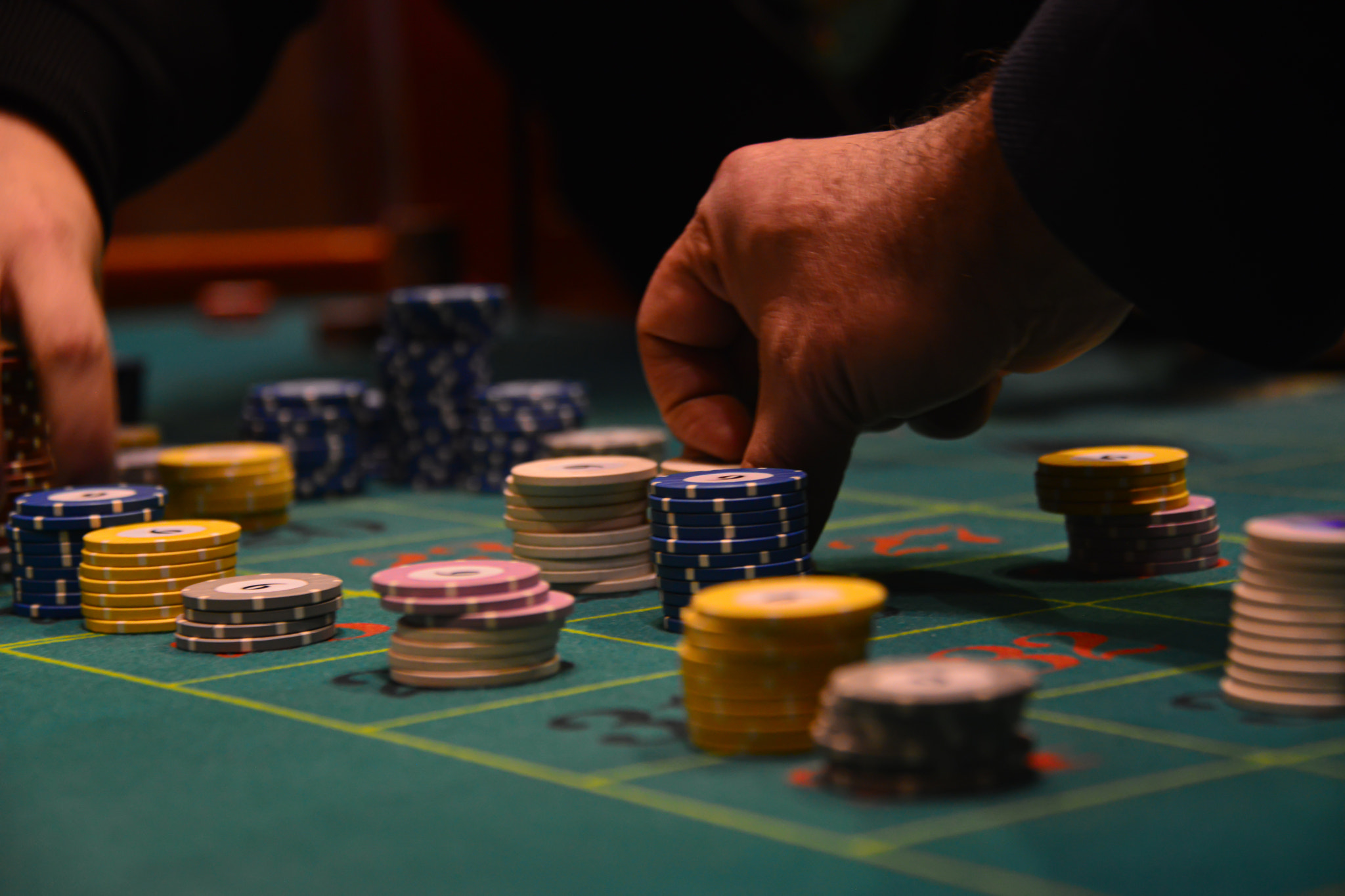 People playing poker in the casino, roulette, gambling.