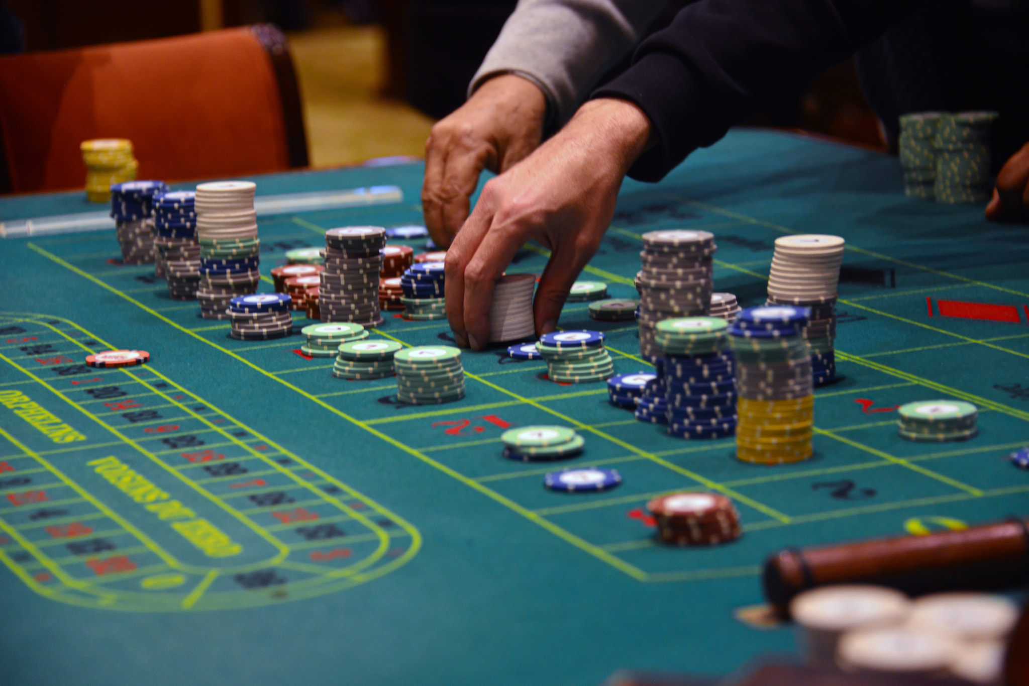 People playing poker in the casino, roulette, gambling.