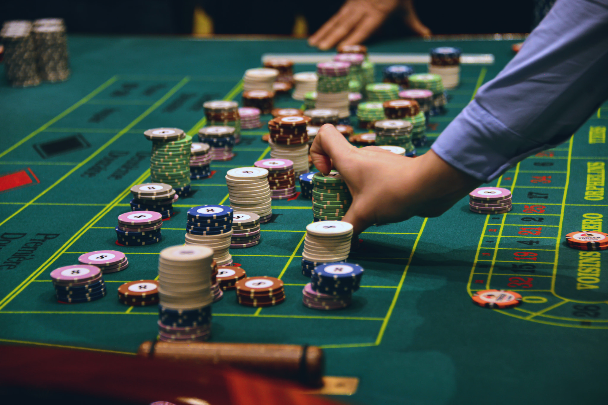 People playing poker in the casino, roulette, gambling.