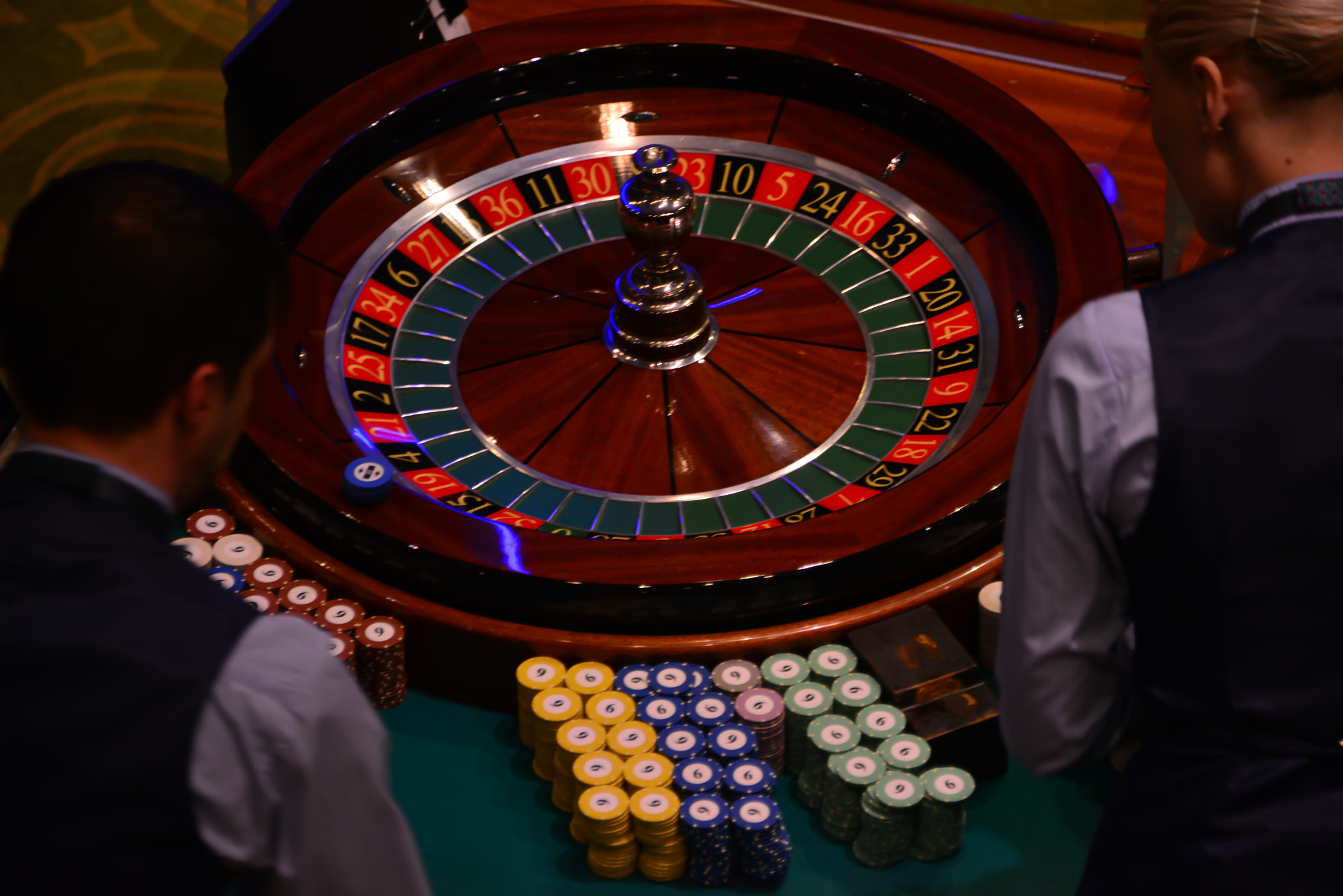 People playing poker in the casino, roulette, gambling.