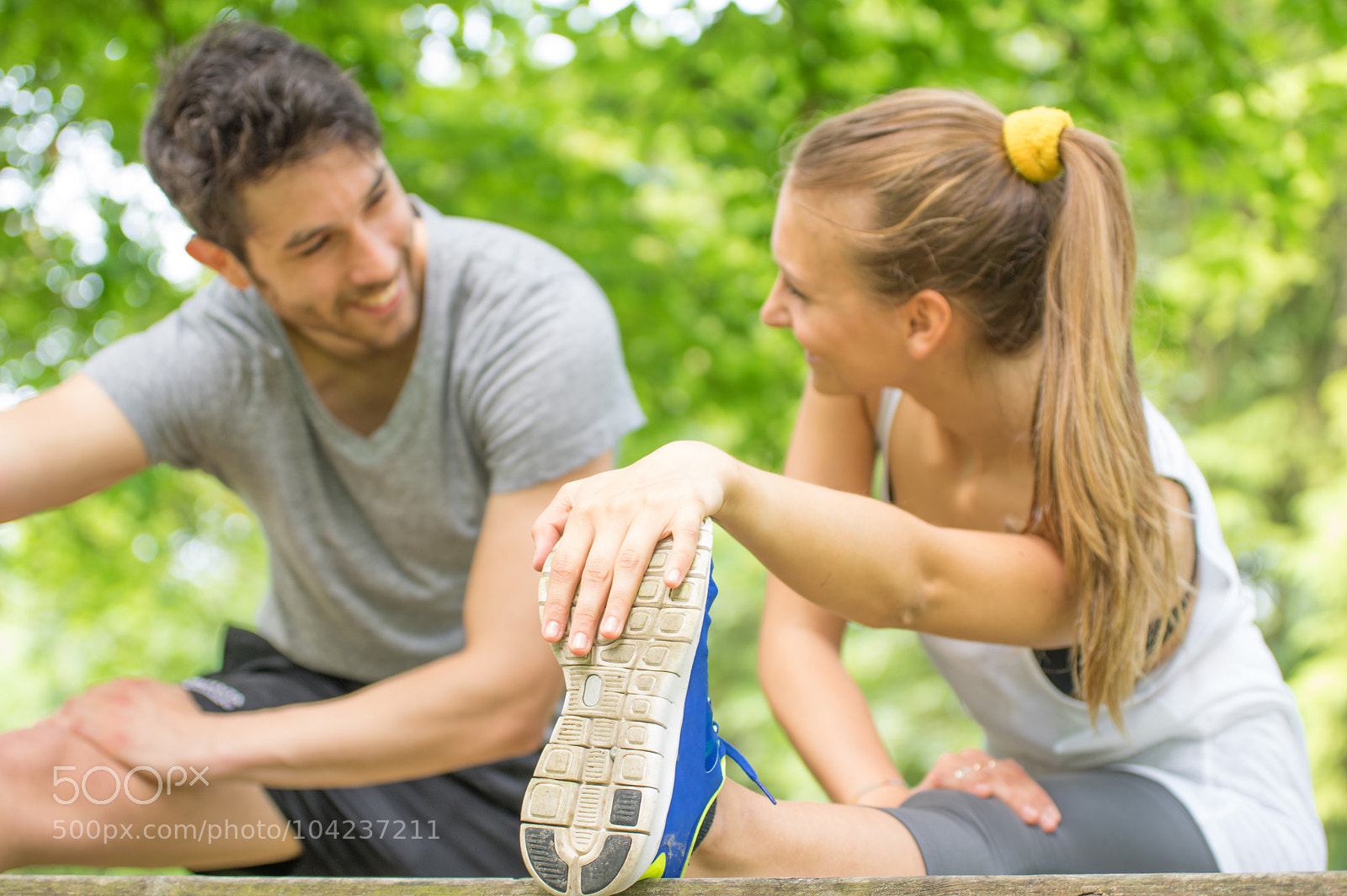 Pentax K-3 sample photo. Sporty couple stretching legs photography