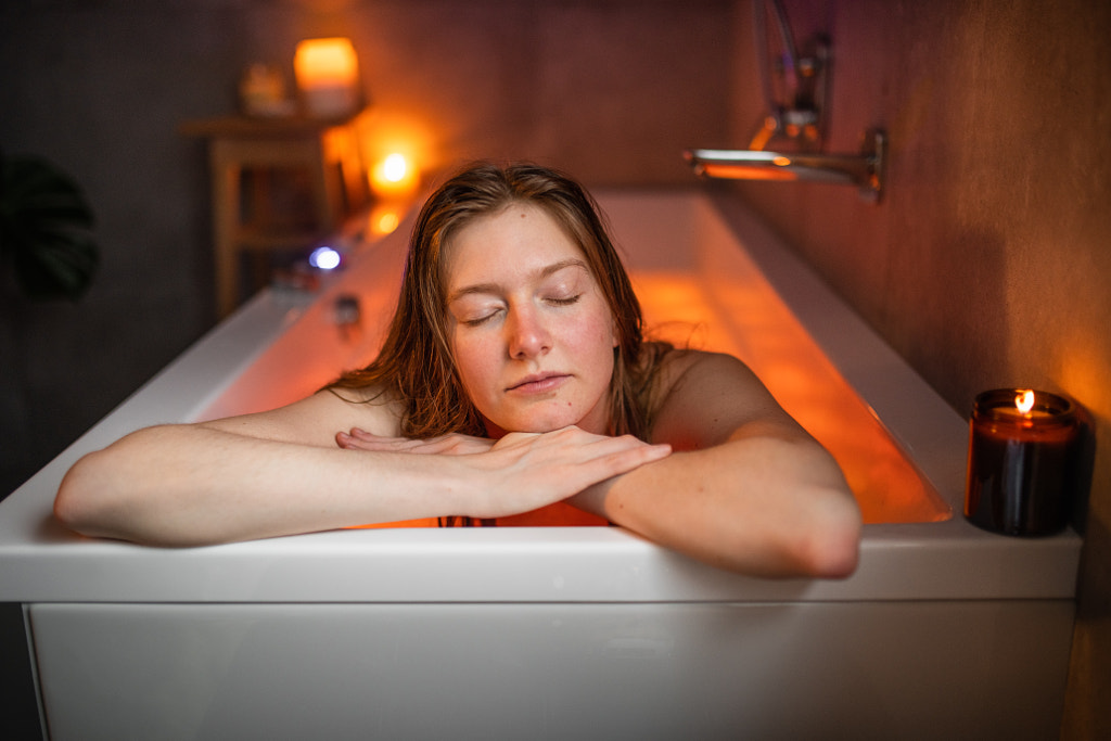 Young woman relaxing in bath by Iza ?yso? on 500px.com