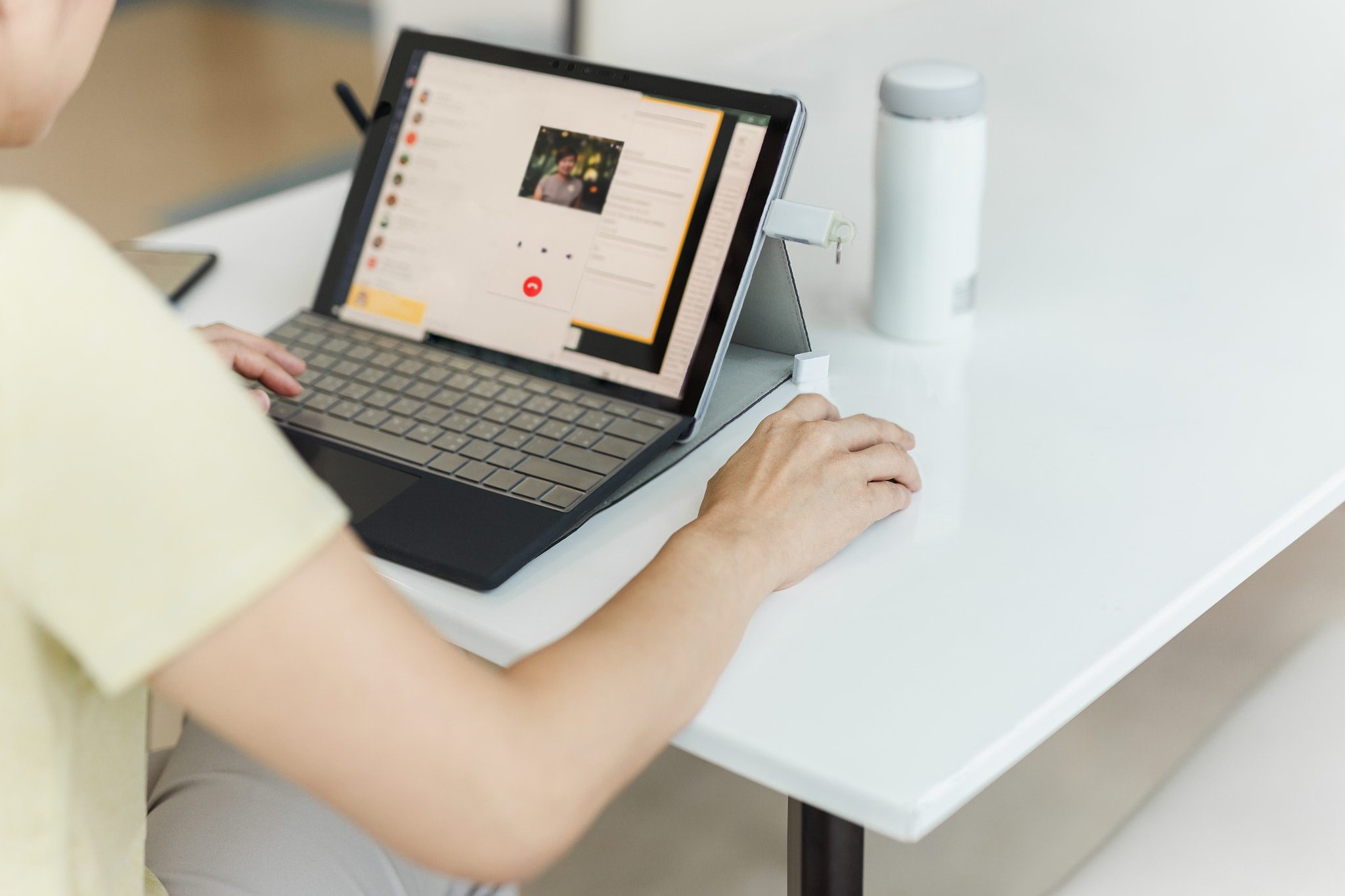 Businesswoman making video call using laptop at home.