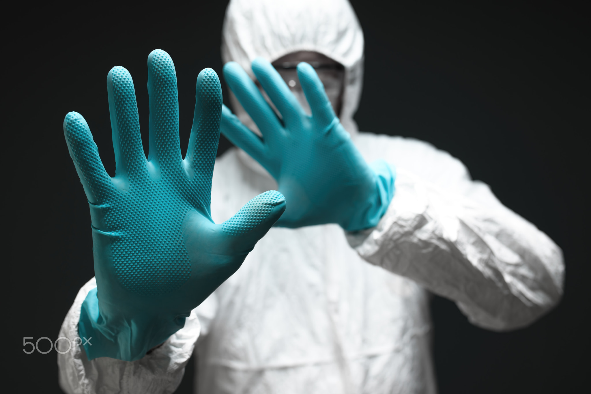 Medical professional in protective coverall