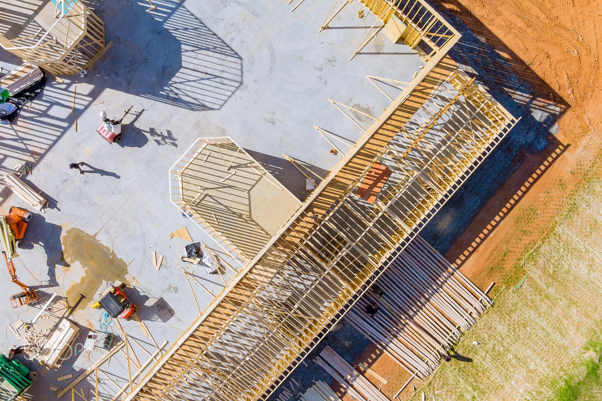 House under construction of wooden beams at construction the roof of