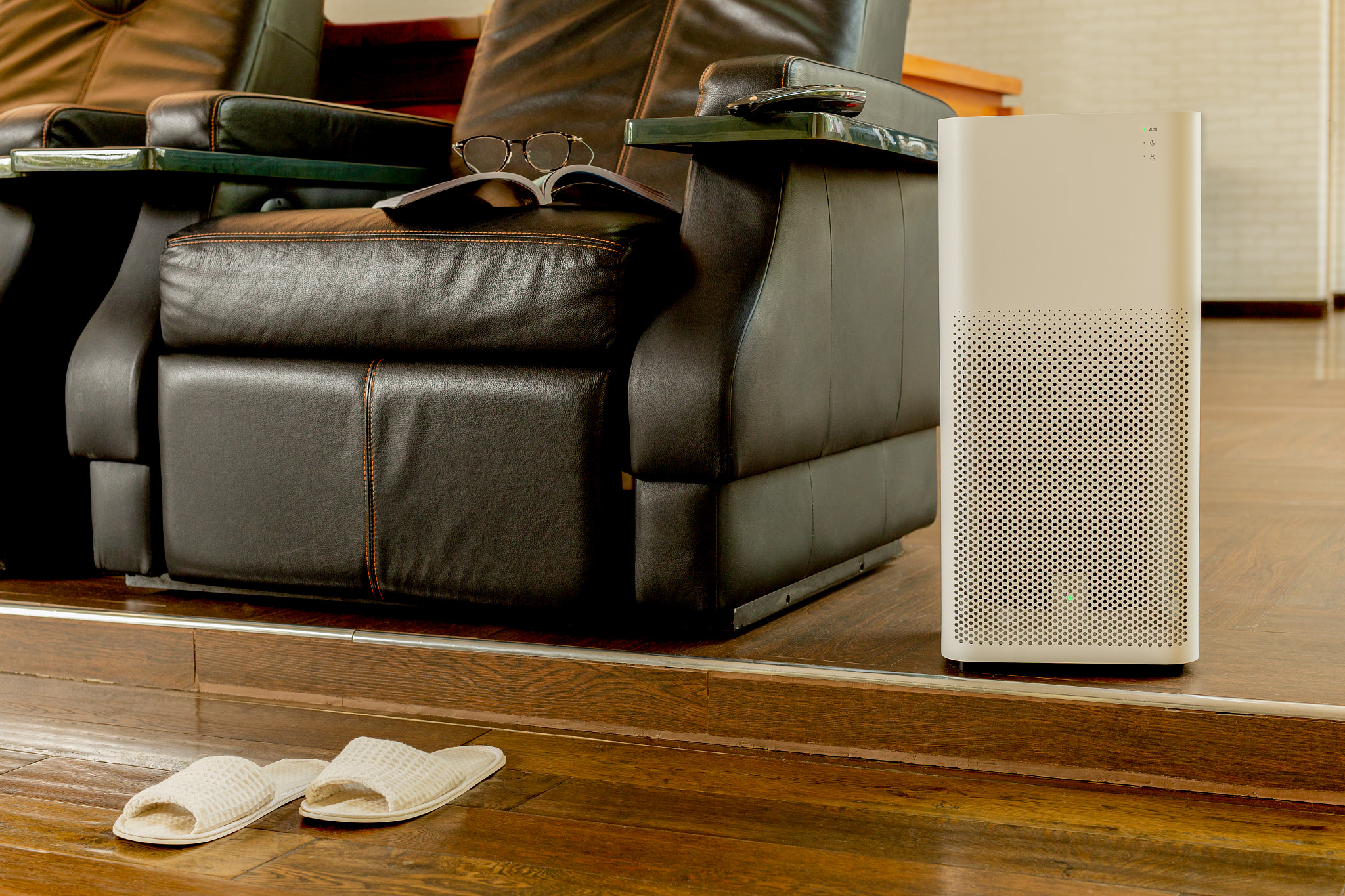 Electric air purifier in a living room for cleaning fine dust.