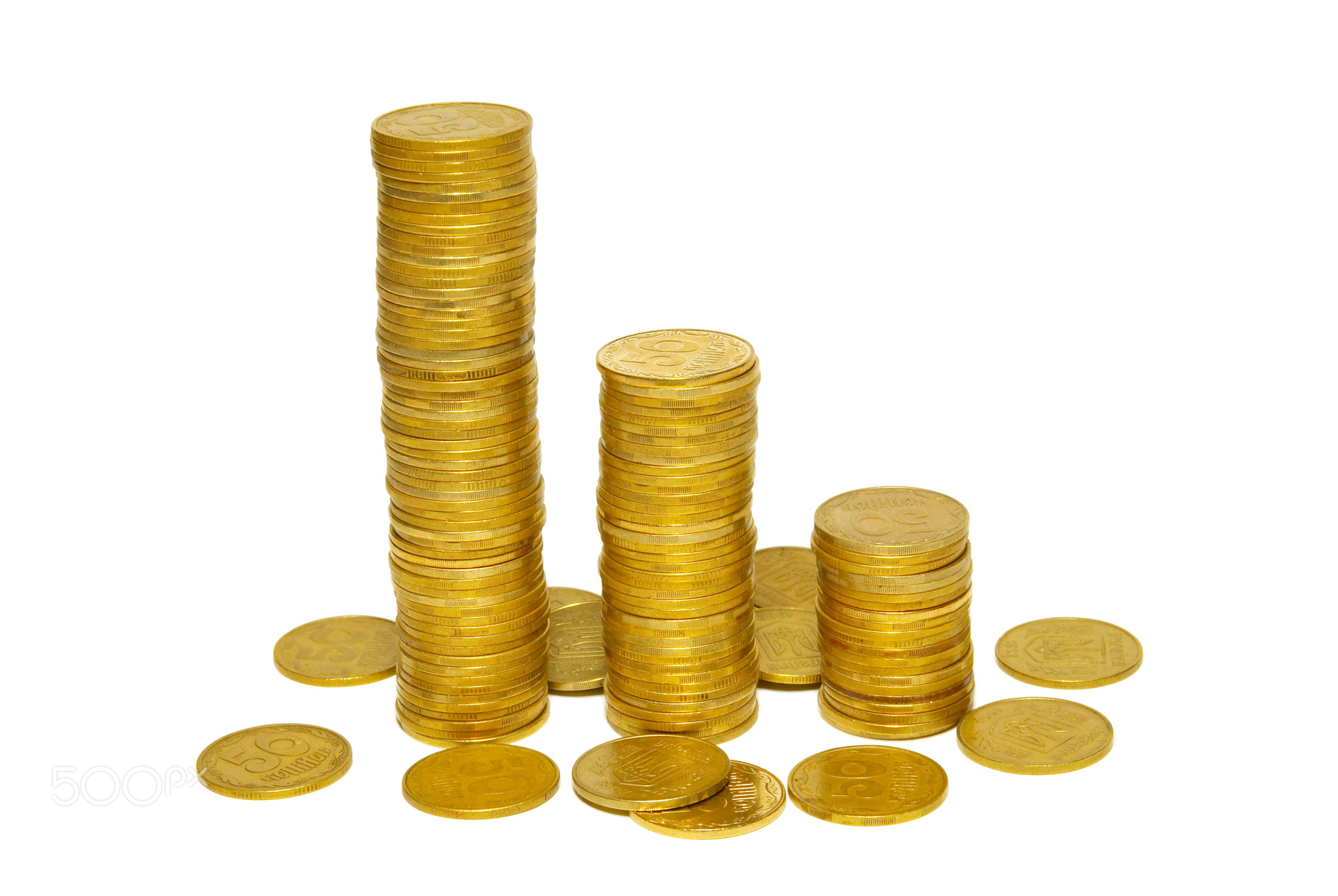 Stacks of golden coins isolated on white.