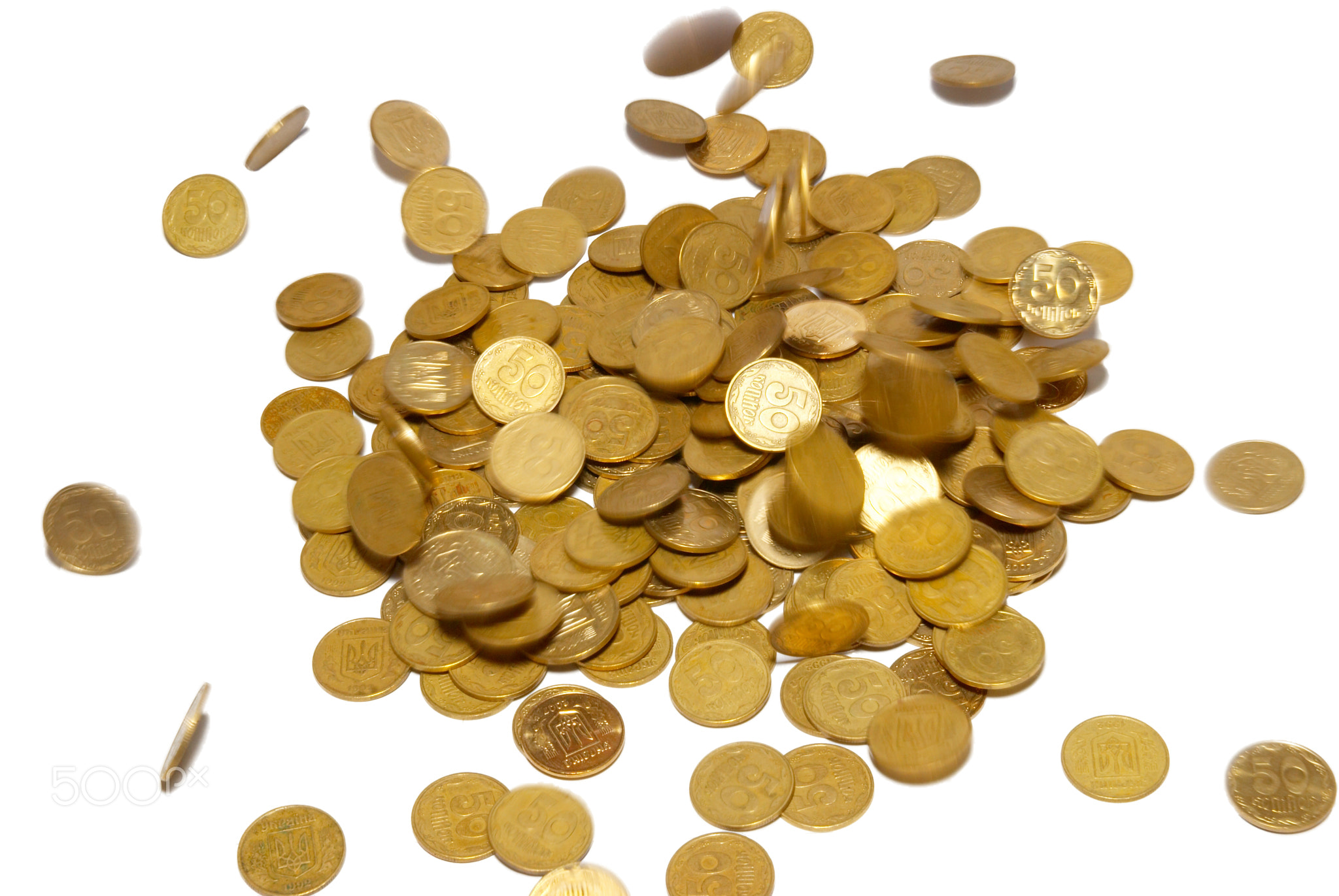 Rain of gold coins isolated on white.