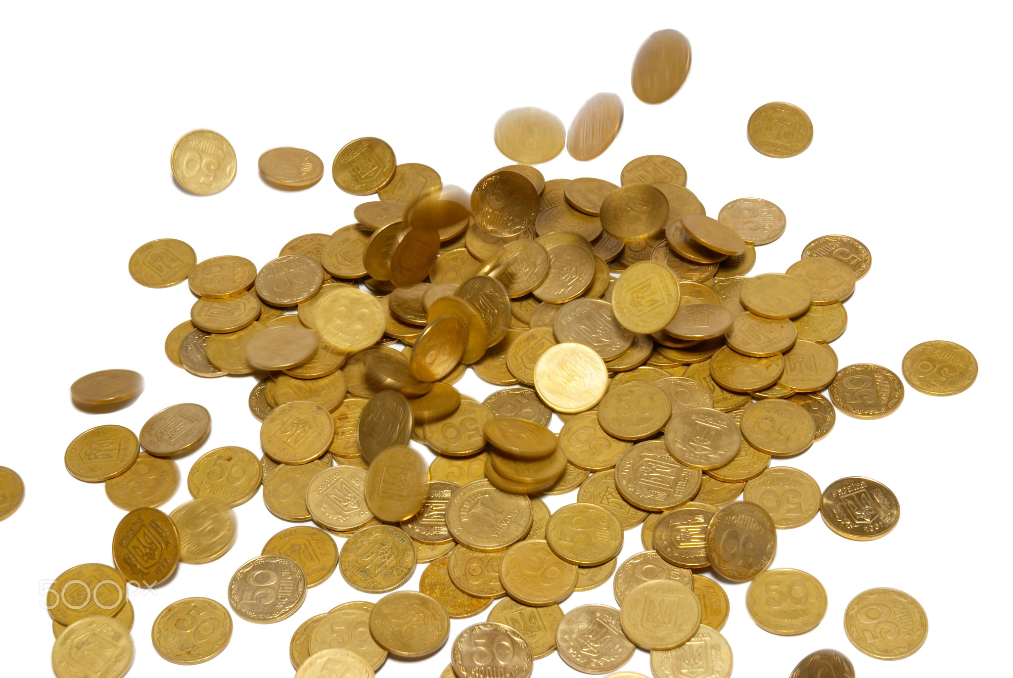 Rain of gold coins isolated on white.