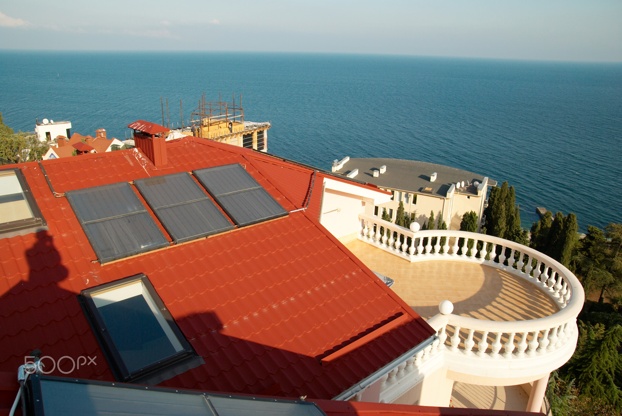 Alternative energy- solar system on the house roof.