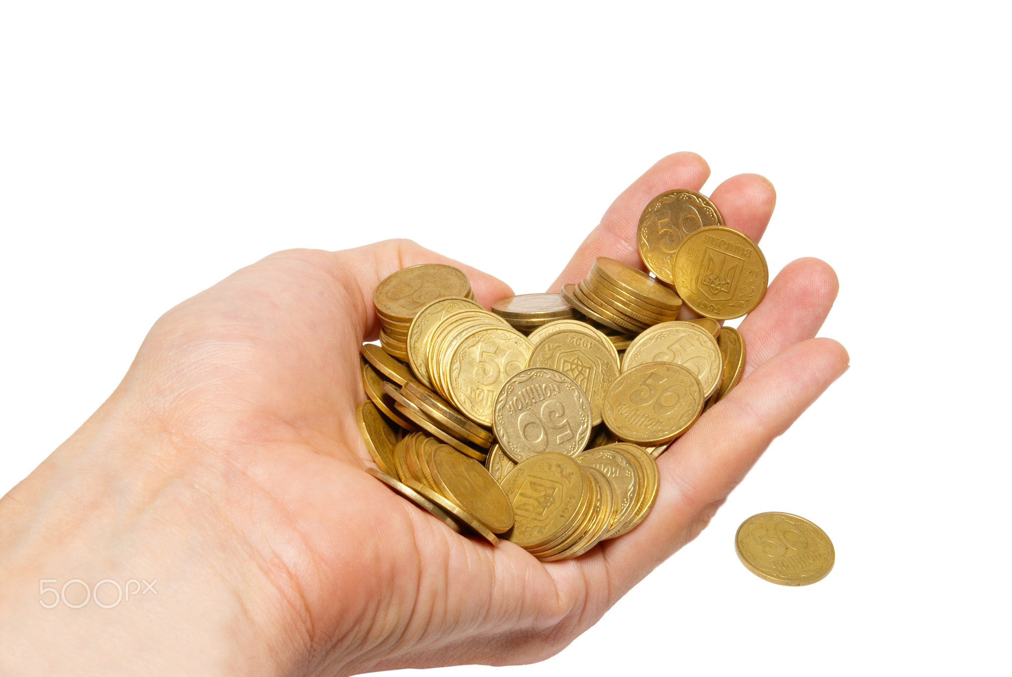 Many coins in cupped hands isolated on white.