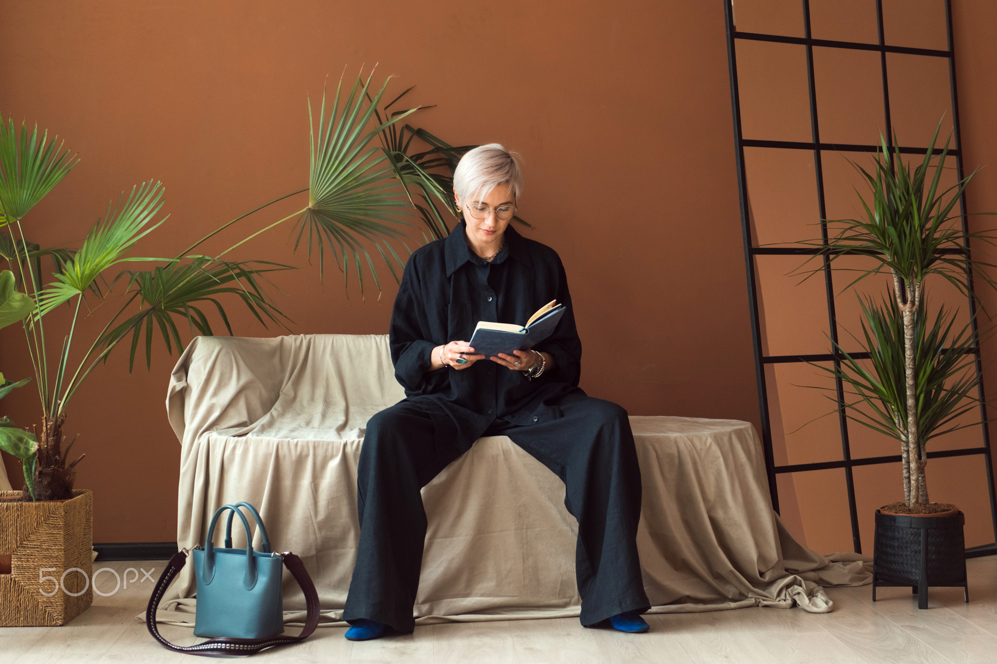 fashion woman in black shirt working in modern work place or office