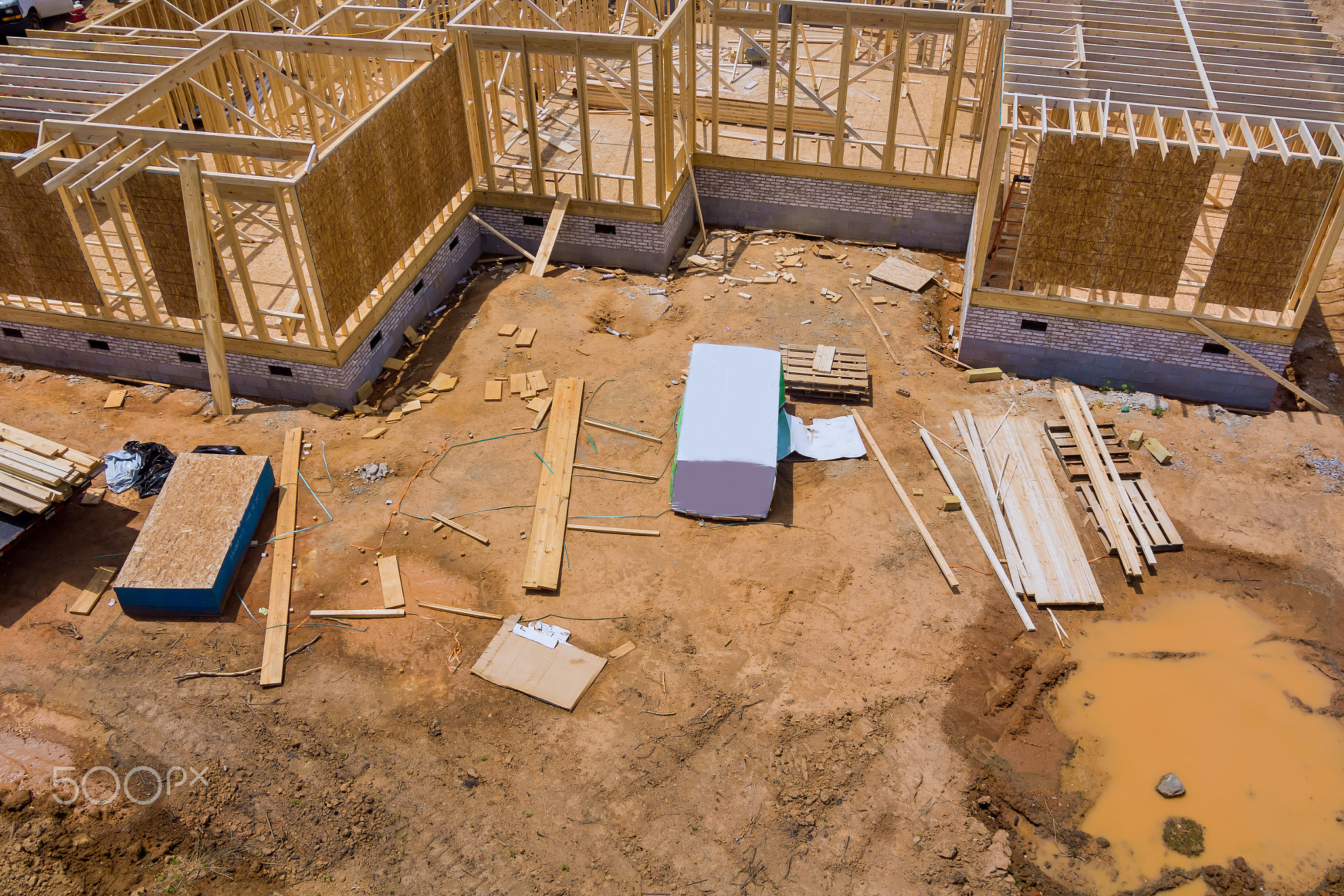 Aerial view the construction wood framing beams of a new house under