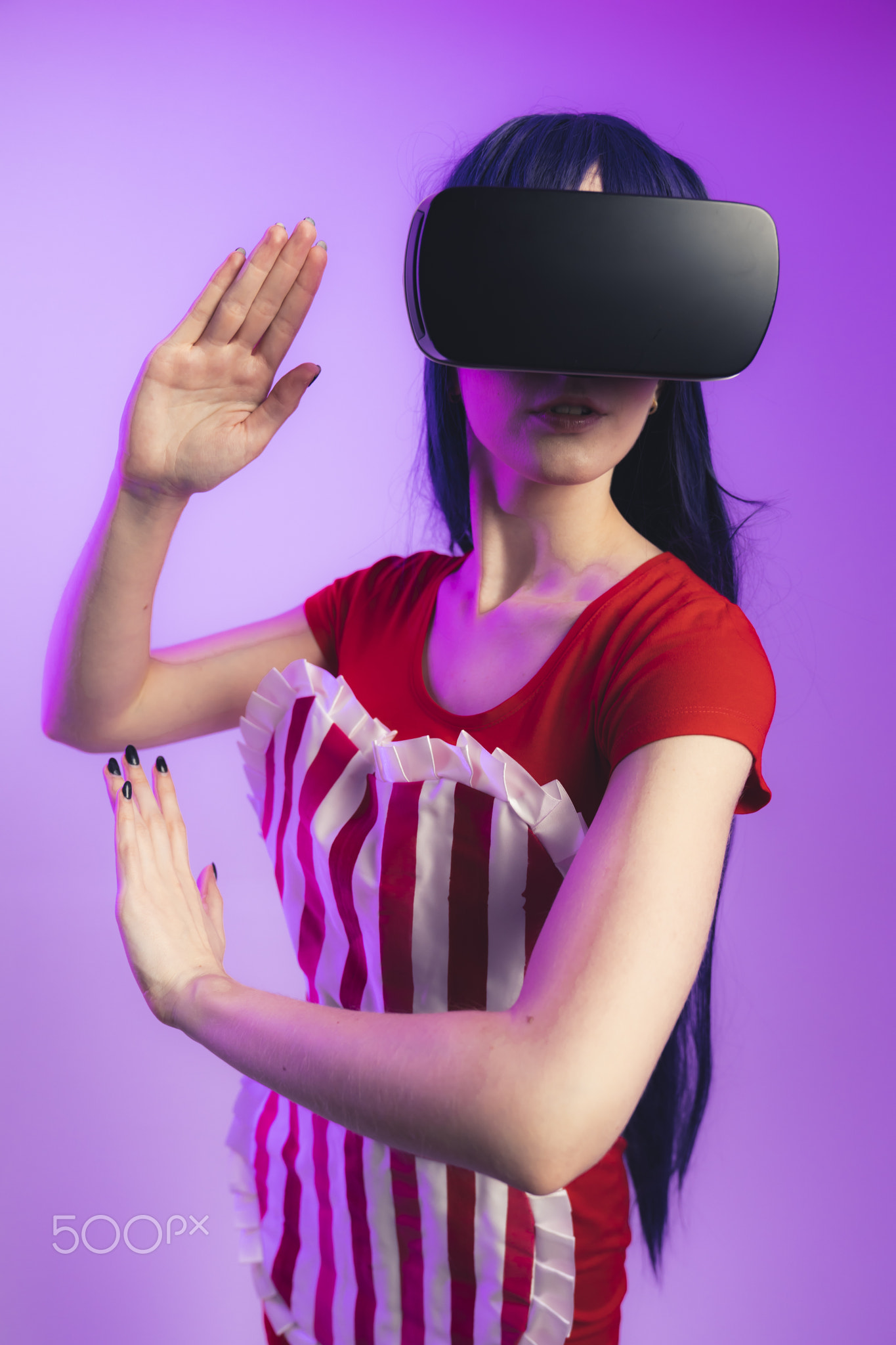 Happy young caucasian woman using a virtual reality headset medium