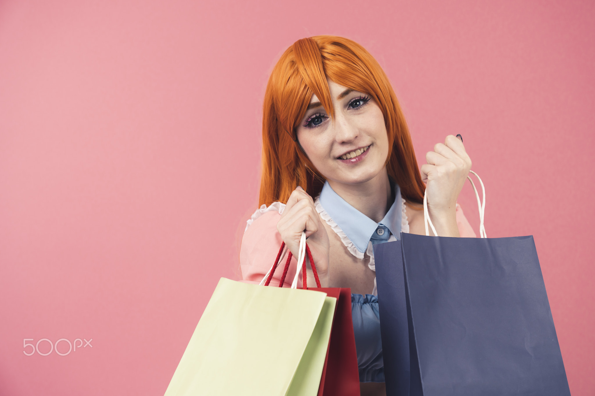 Sweet caucasian cosplayer with shopping bags for valentines and more