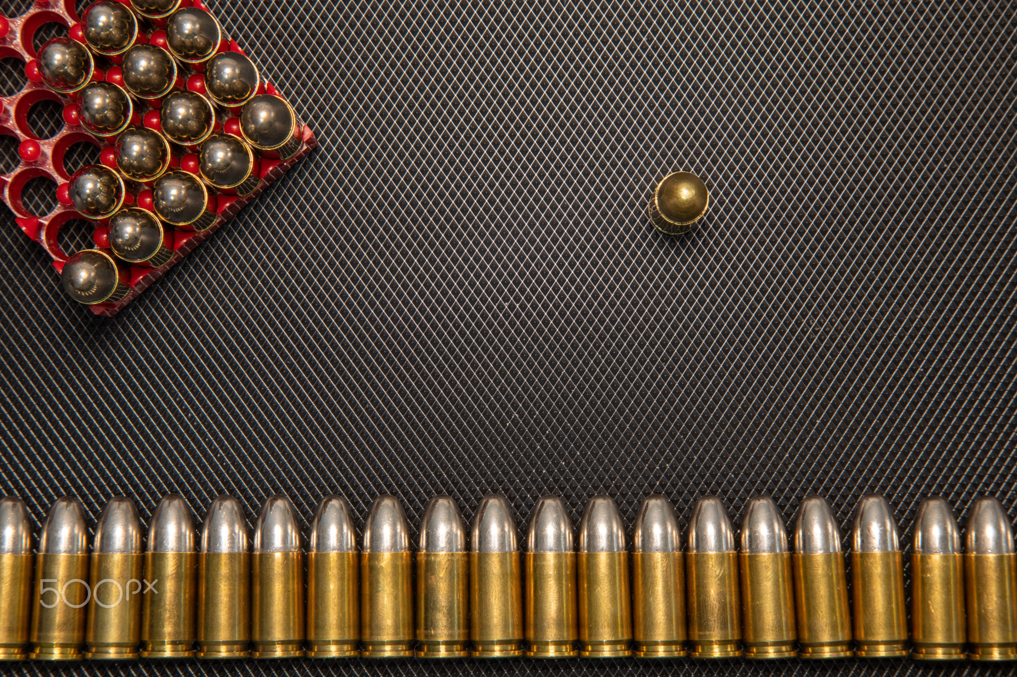 War concept. Bullets and shells in the hands of a child, against the