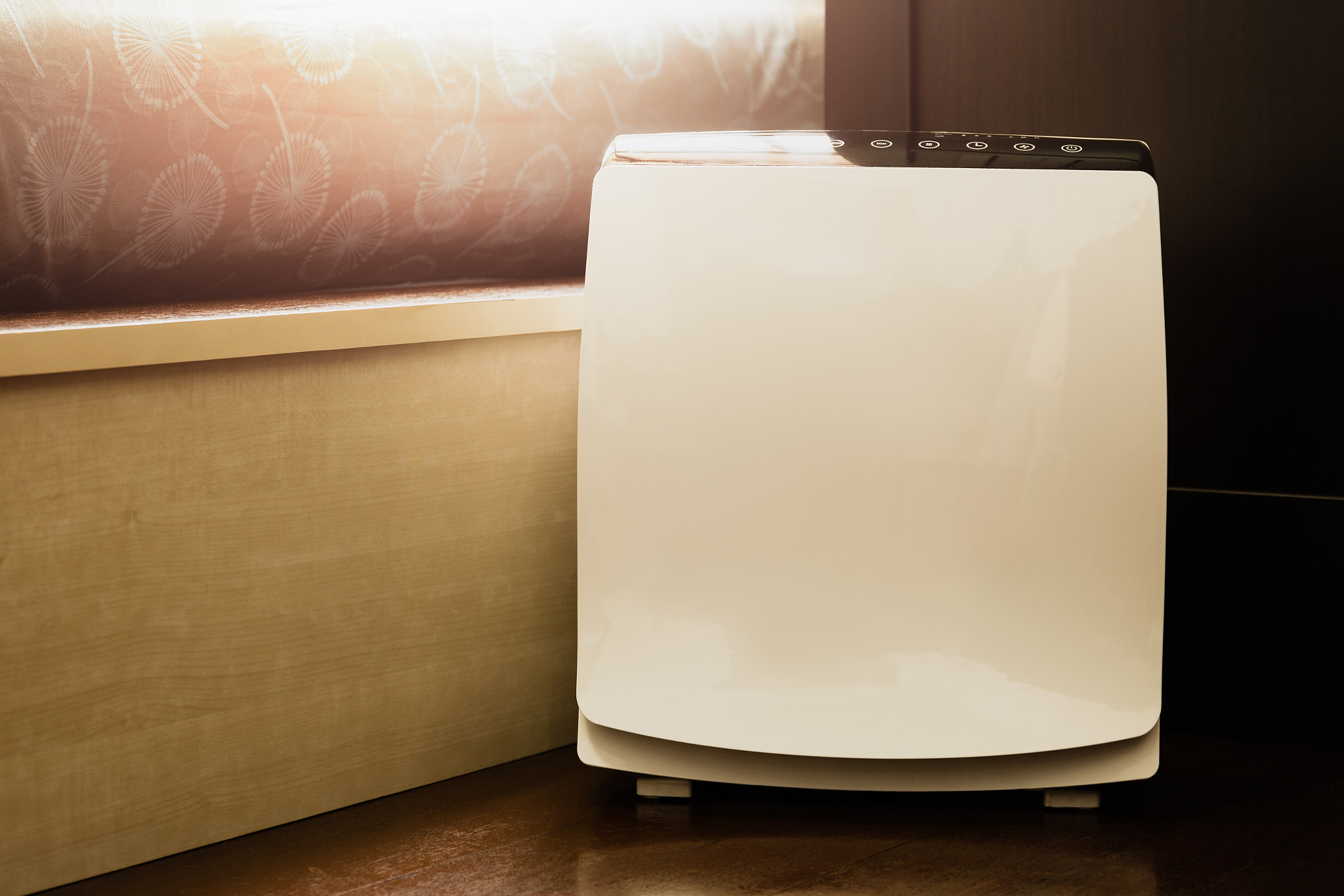 Air purifier in the bed room cleaner removing fine dust in house.