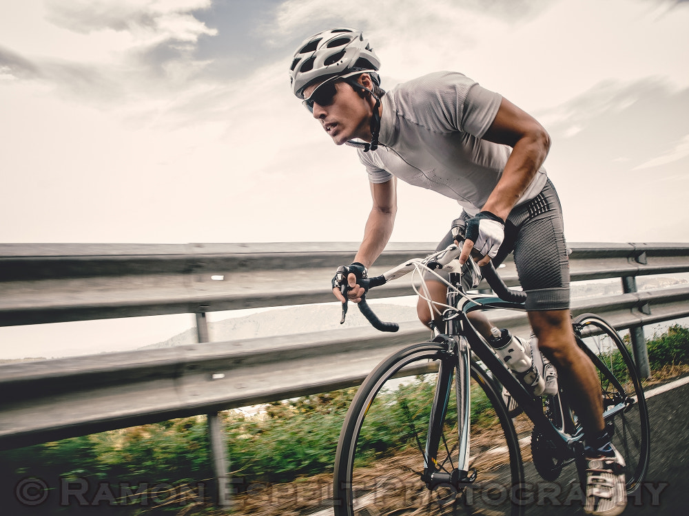 Cyclist in maximum effort in a road