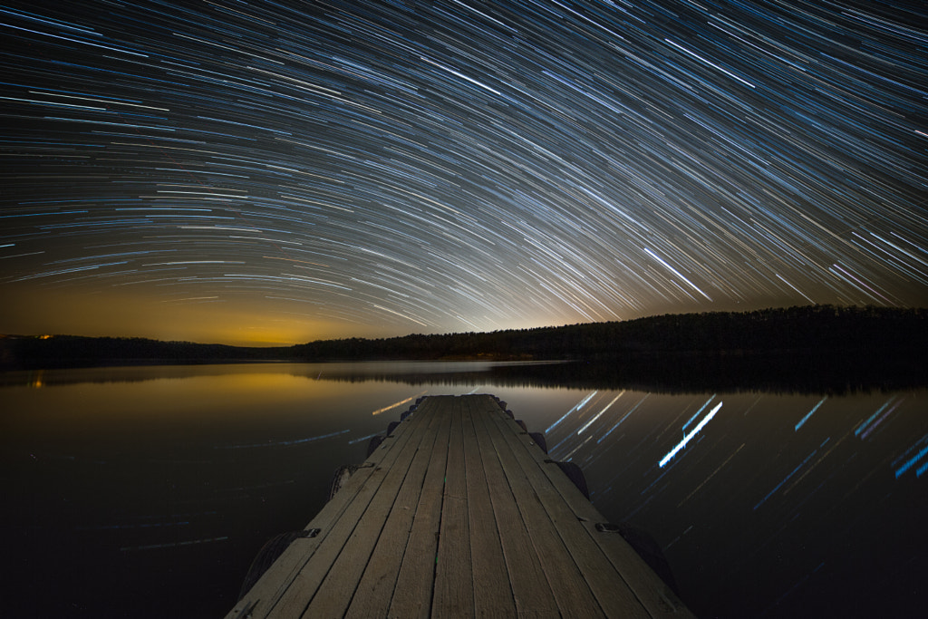 Startrails over the lake. by Benjamin King on 500px.com