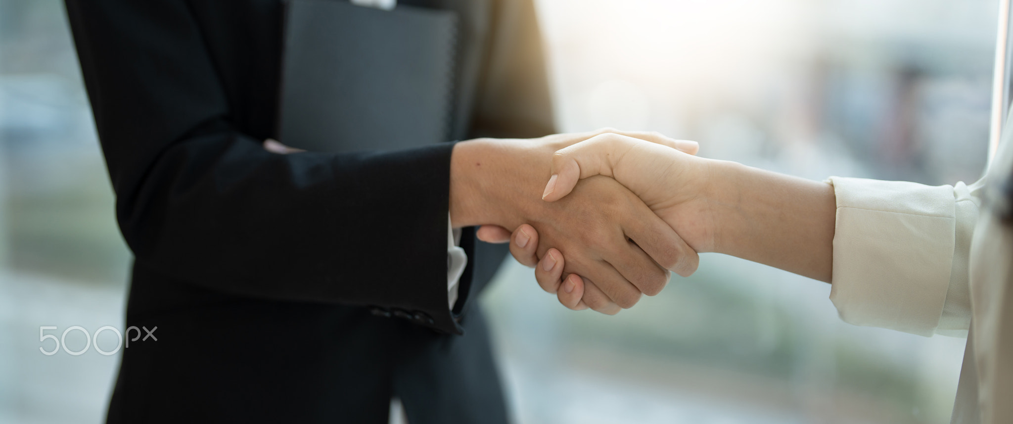 Close up of Business people shaking hands, finishing up meeting