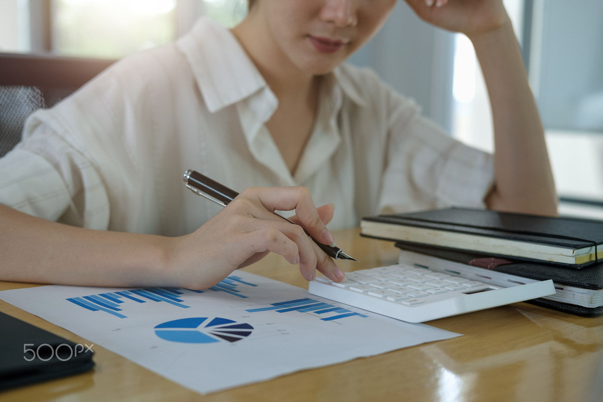 Closeup hands of businesswoman or accountant working on desk office