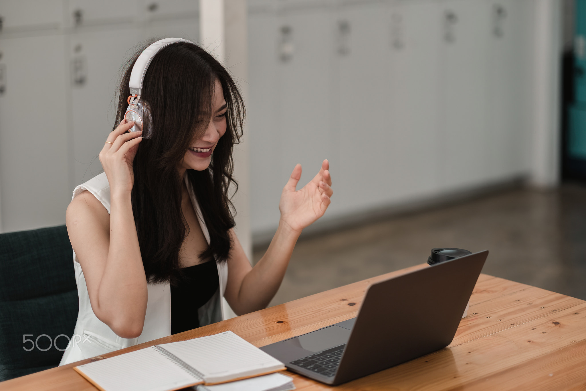 Smiling girl student wear wireless headphone study online with teacher