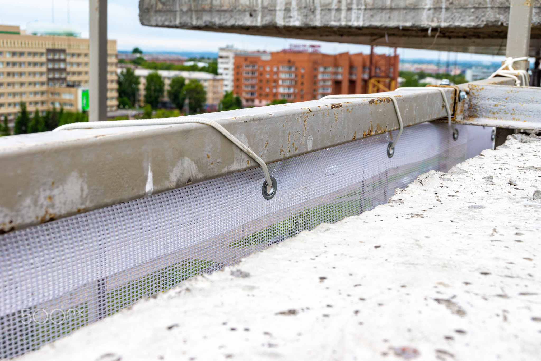 facade protective mesh stretched over a steel frame for fencing