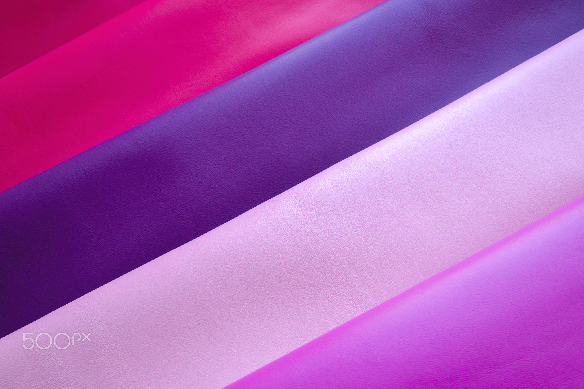 Close up of fuxia, purple, pink and violet soft nappa leather.