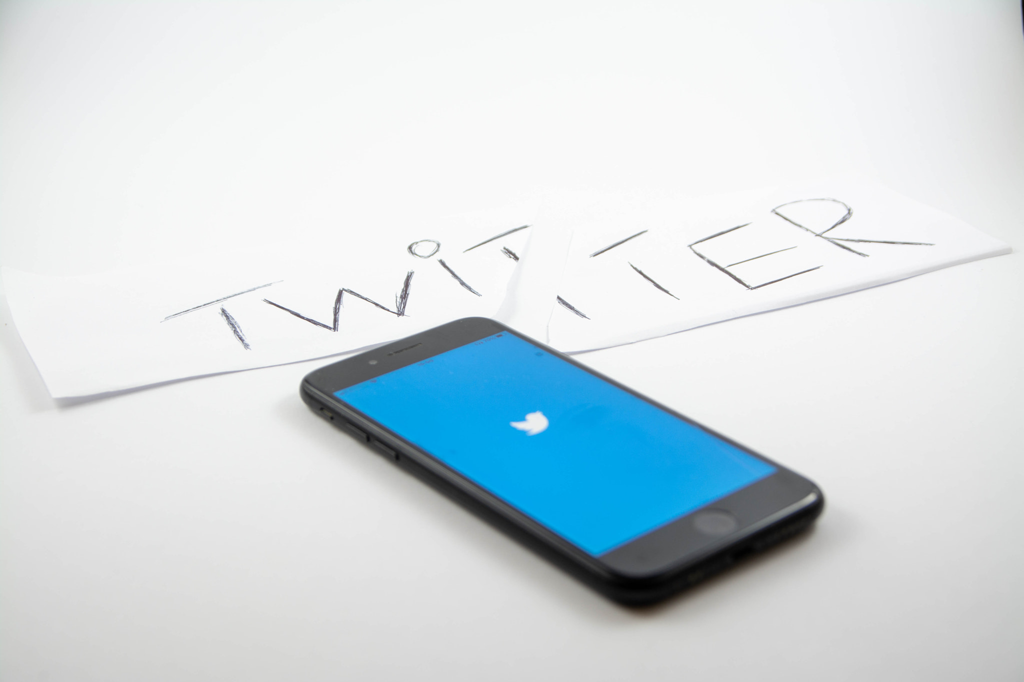 Social Media logo on a mobile phone - white isolated