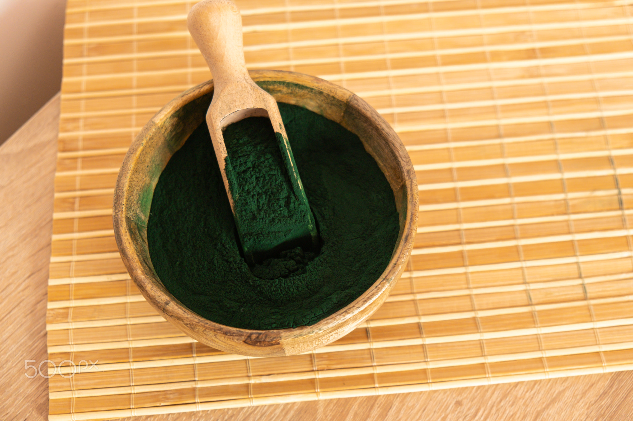 Blue-green algae Chlorella and spirulina powder in bamboo eco bowl