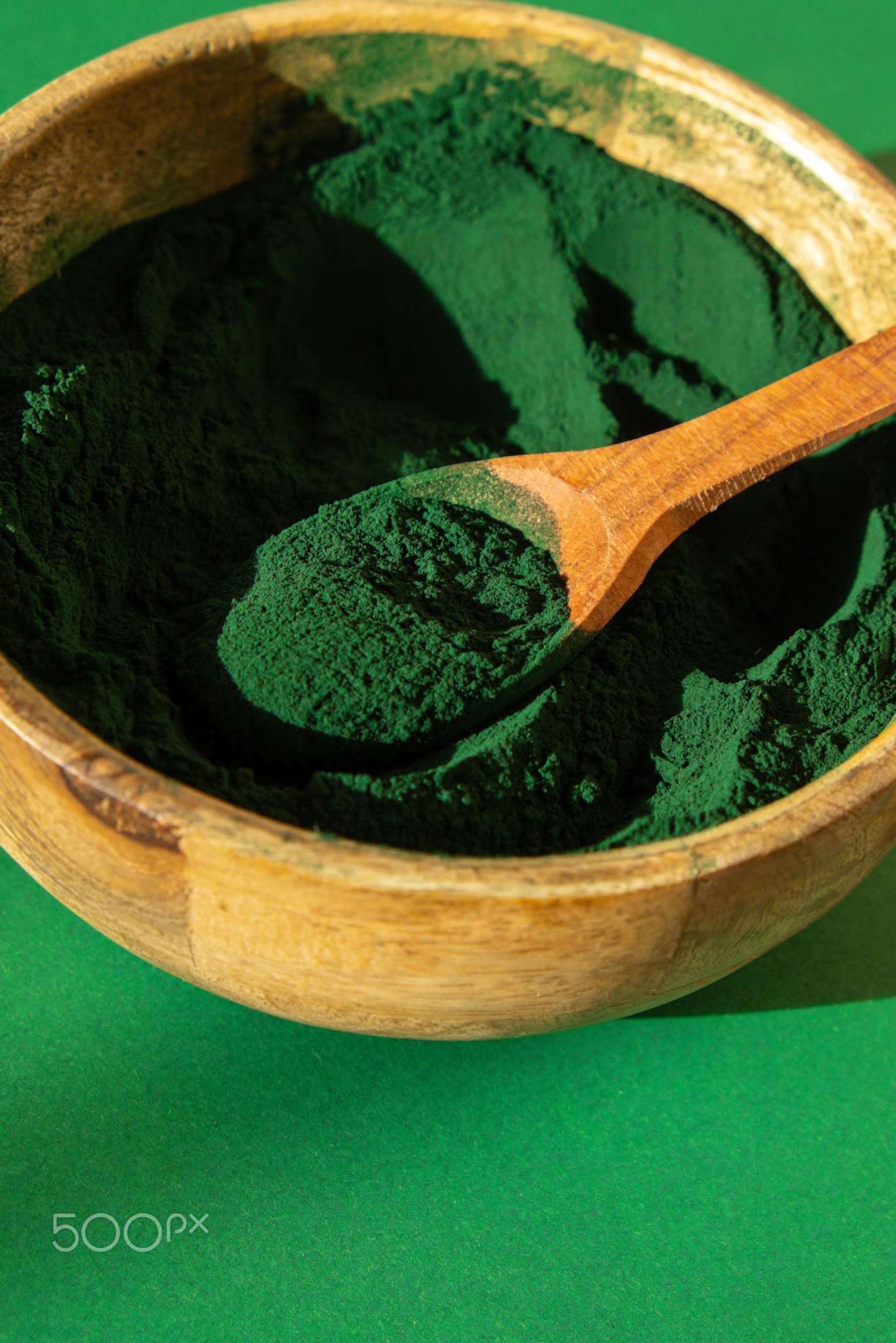 Blue-green algae Chlorella and spirulina powder in bamboo eco bowl