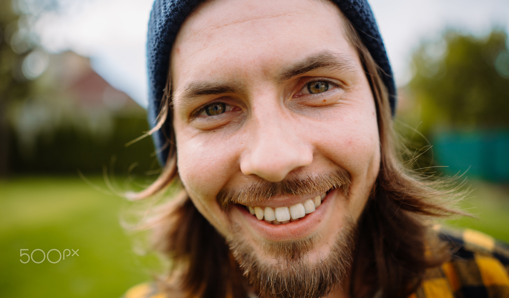 Close-up portrait of male gardener. Farmer looking at camera
